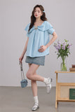 Blue Ruffled Blouse with Decorative Ring