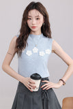 Blue Sleeveless Top with White Flower Embellishments