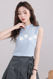 Blue Sleeveless Top with White Flower Embellishments