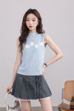 Blue Sleeveless Top with White Flower Embellishments